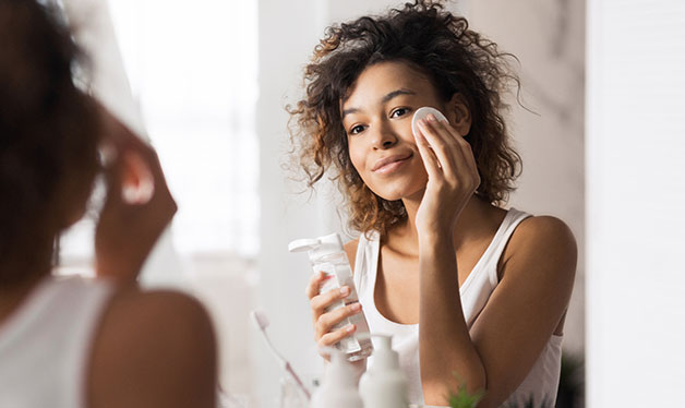 woman watching herself in the mirror