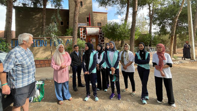 Mike McHugo with staff and students of Education for All's boarding house number three, which was badly damaged in last week's earthquake. This photo was taken Sept. 14, 2022.