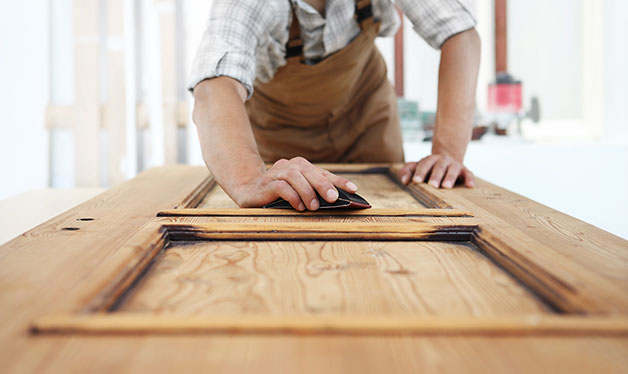 man building a door