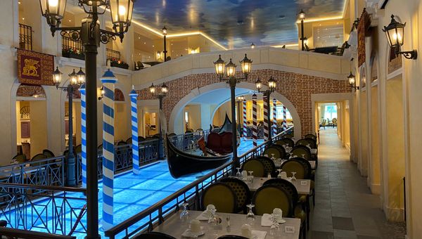 The center of the Canal Grande Restaurant features a gondola on a faux canal.