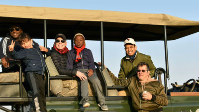 Jeffrey Solomon (front right) with family and friends on a pilot safari for same-sex families offered by African Travel Inc.